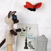 sfeerfoto handpop harry gehaakt met vuilnisbak vlinder en boek huis van harry